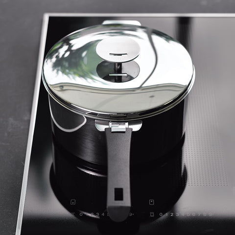 HOW CAN I REMOVE BURN STAINS FROM AN INDUCTION HOT PLATE?