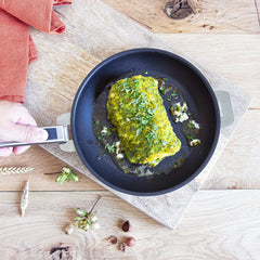 Breaded fish with hazelnut and herbs