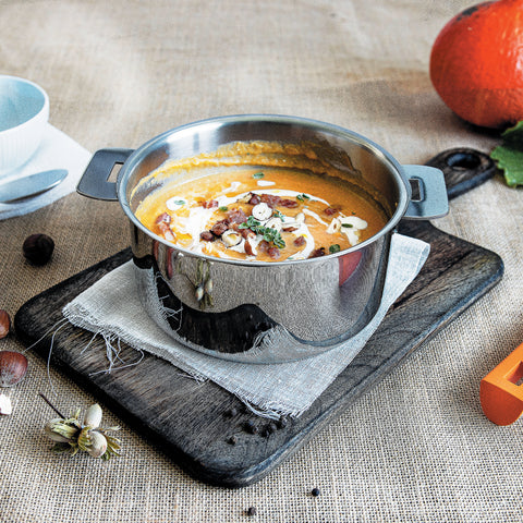 Cream of pumpkin soup with bacon and hazelnuts